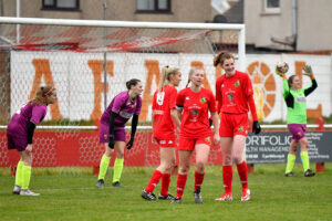 Llanelli Town Ladies players celebrate scoring against Afan Lido Ladies