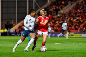Marie-Antoinette Katoto of France Women battles with Gemma Evans of Wales Women