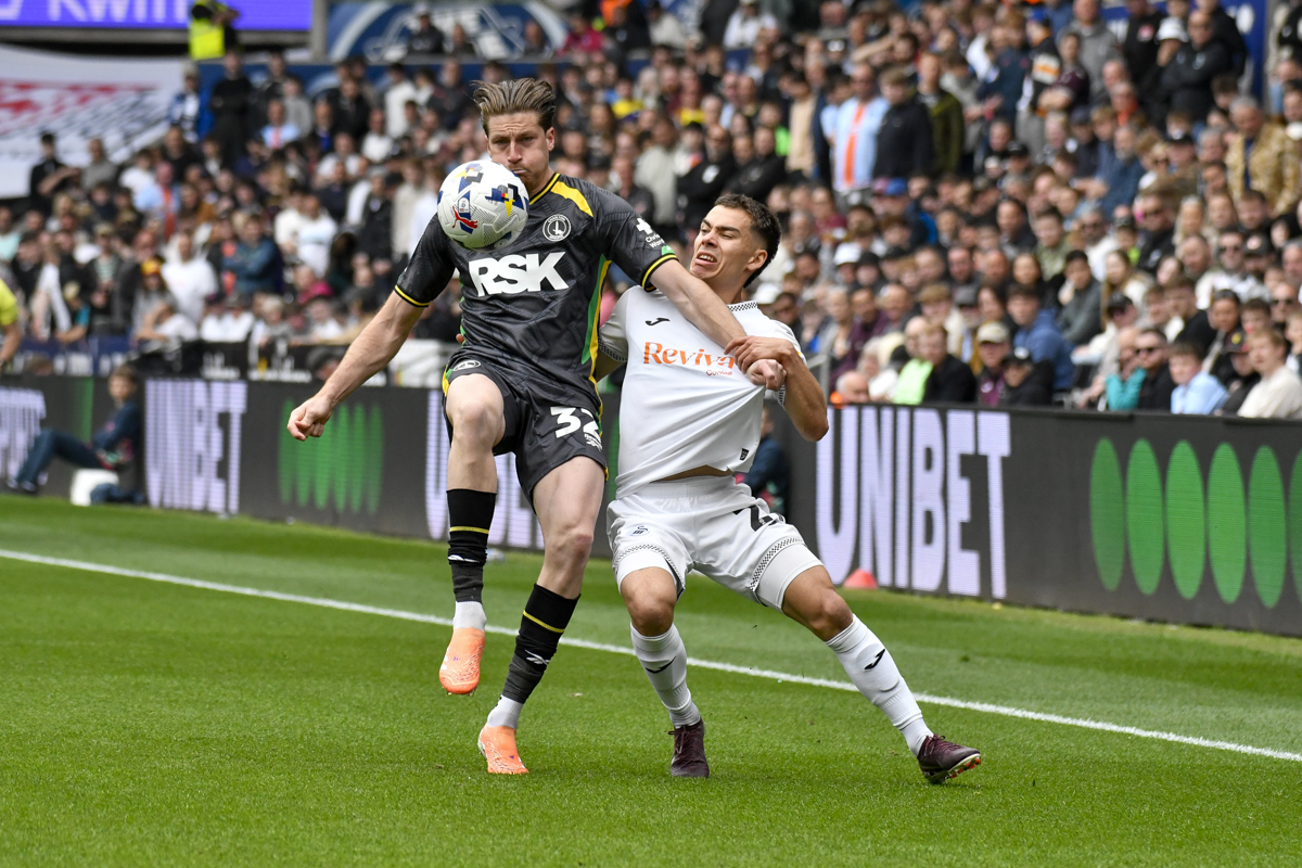 Swansea, Wales. 2 May 2026. Reece Burke of Charlton Athletic battles for possession with Leo Walta of Swansea City during the EFL Championship match between Swansea City and Charlton Athletic at the Swansea.com Stadium in Swansea, Wales, UK on 2 May 2026. Credit: Duncan Thomas/Majestic Media/Swansea Bay News.